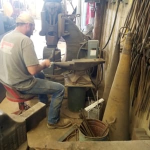 A member of our team working on a custom anvil