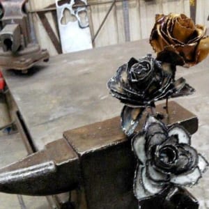 Metal anvil with flowers