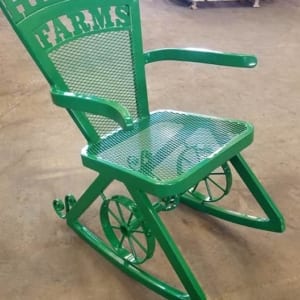 Green metal rocking chair for Helwig Farms